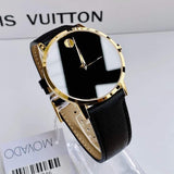 Movado gold watch with black face and leather band