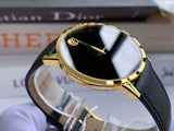 Gold Movado watch with black dial and band