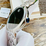 Movado watch with black face and silver band