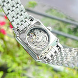 Armani watch with visible movement and silver band