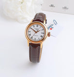Tissot watch with brown leather strap and gold case