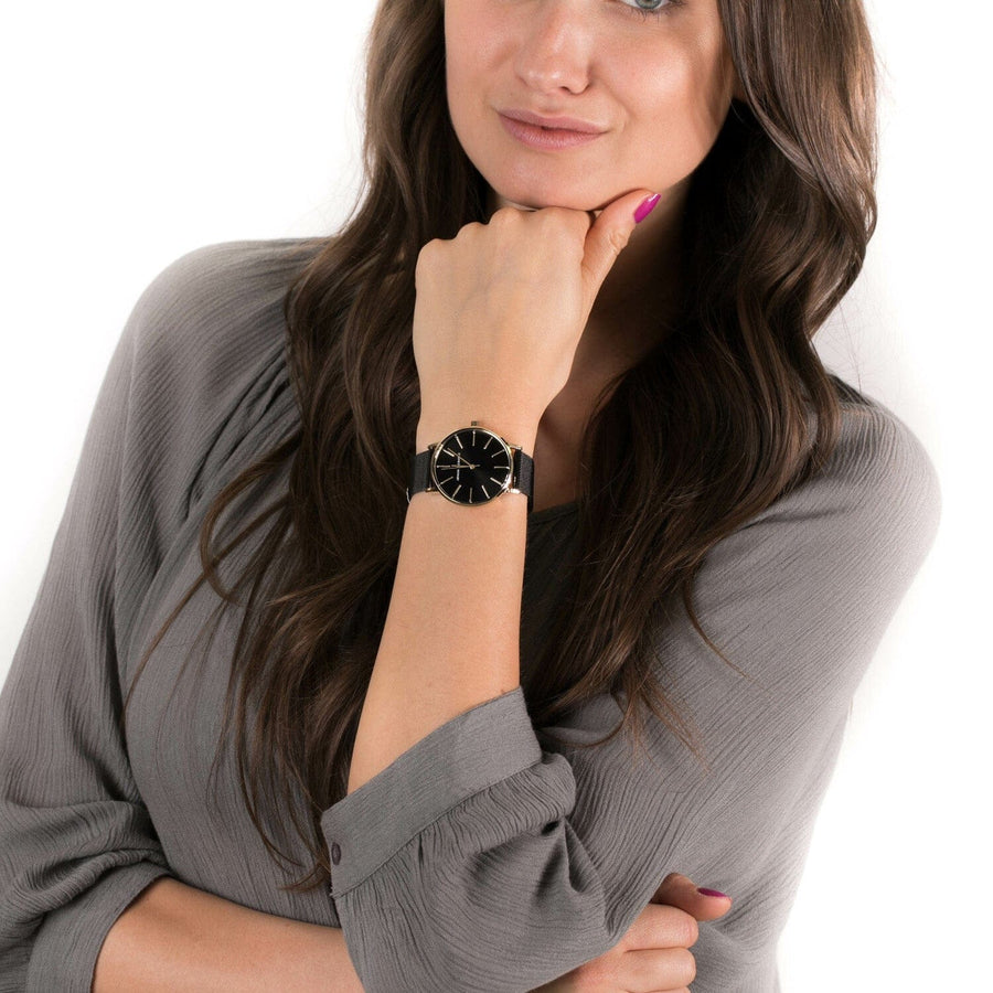 Woman wearing Armani Exchange gold watch